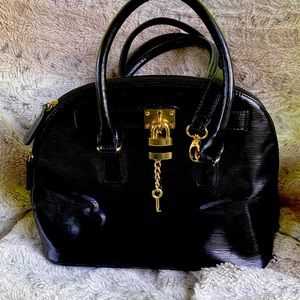 Women’s purse black with gold accents. Gently used.  Very good condition